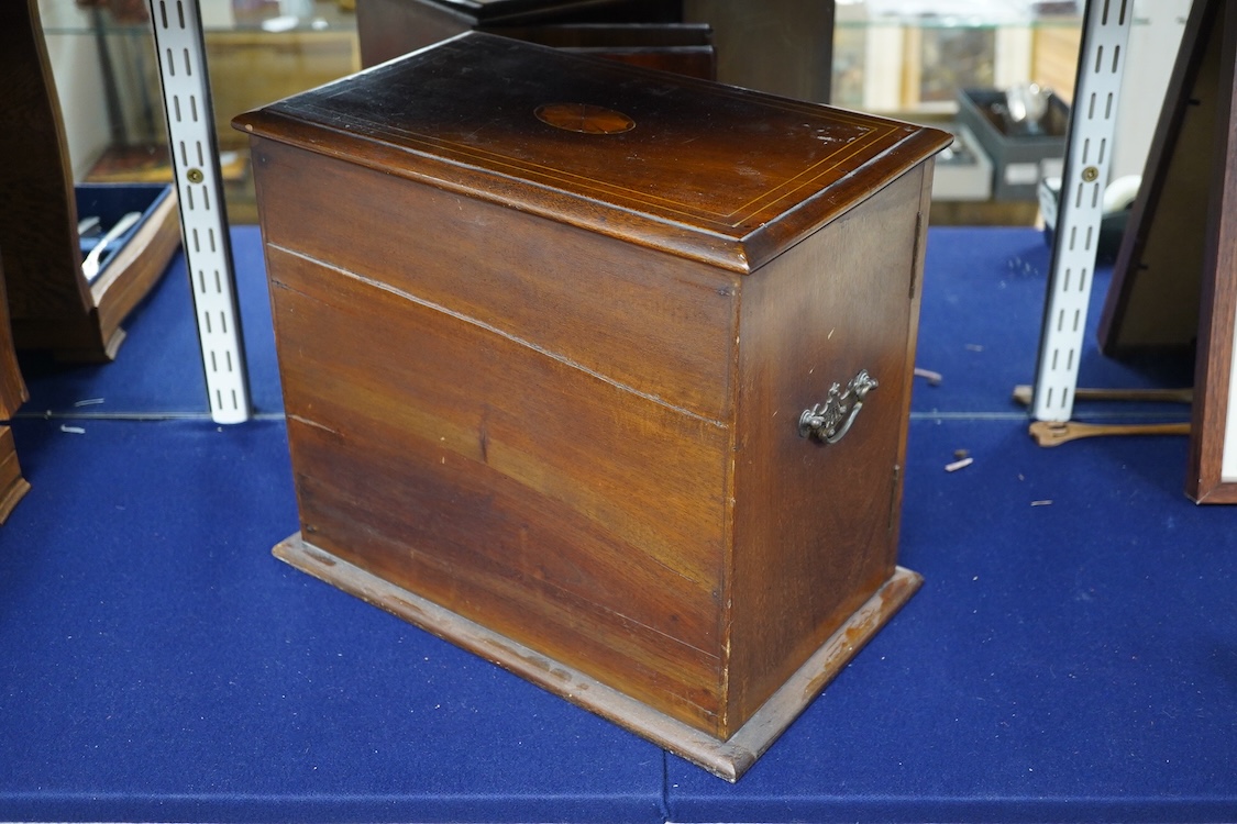 An Edwardian mahogany inlay two door smoker's cabinet, 30.5cm high, 35.5cm wide. Condition - fair